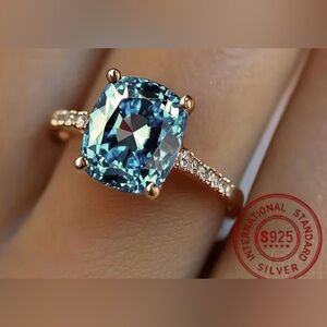Gold Ring with Teal Cushion-Cut Center Stone and Pavé Accents